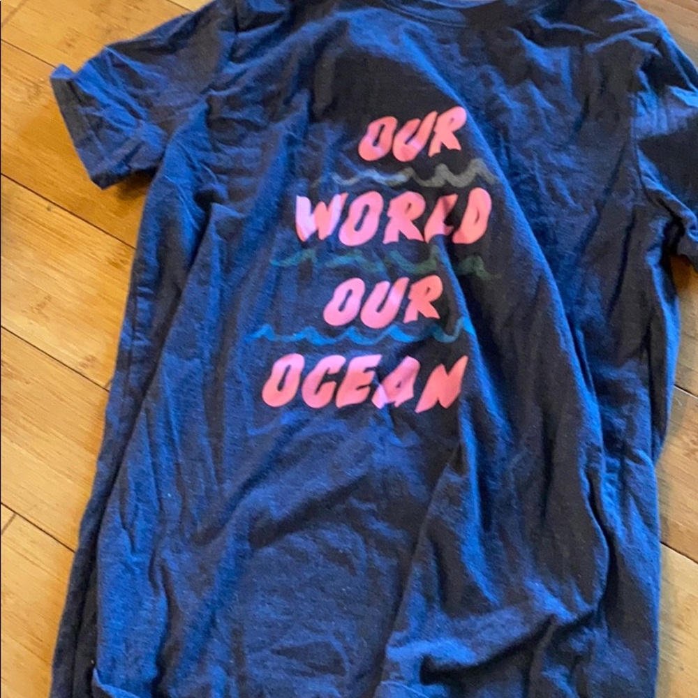 Gray tee with pink lettering.